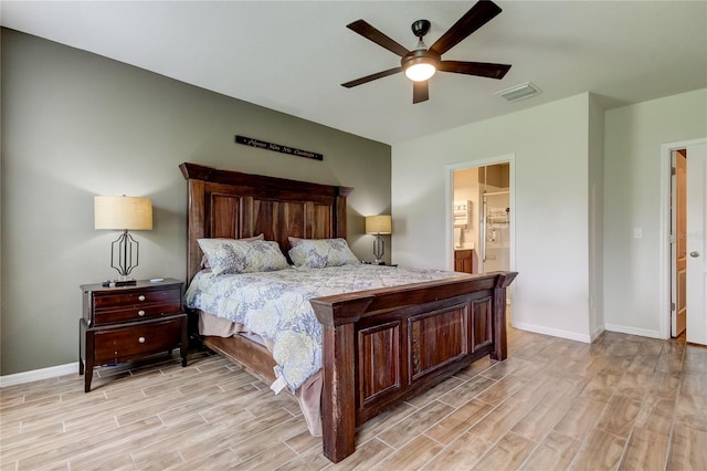 bedroom with ceiling fan, light hardwood / wood-style floors, and ensuite bath