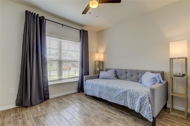 bedroom featuring ceiling fan and hardwood / wood-style flooring