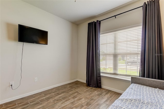 bedroom with light hardwood / wood-style flooring