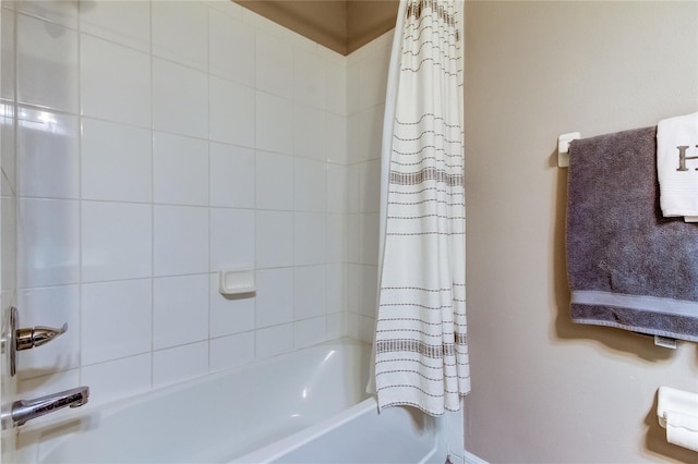 bathroom with shower / bath combination with curtain