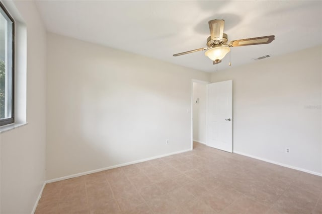 empty room featuring ceiling fan