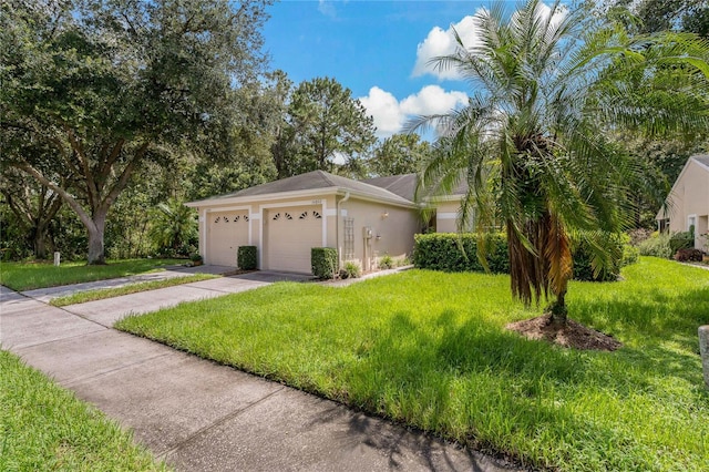 exterior space featuring a lawn and a garage