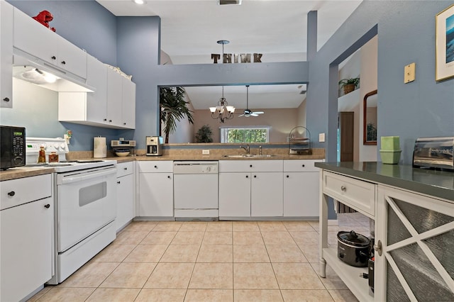 kitchen with a notable chandelier, white appliances, and white cabinetry