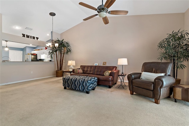 carpeted living room with high vaulted ceiling and ceiling fan