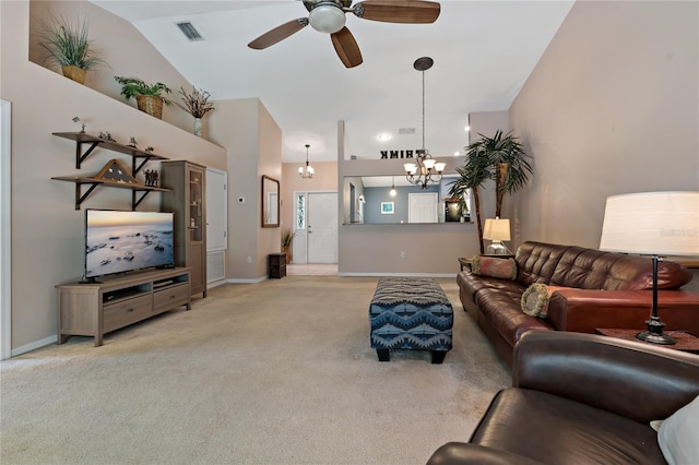 living room featuring high vaulted ceiling, ceiling fan with notable chandelier, and light colored carpet