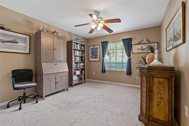 office area with light colored carpet and ceiling fan