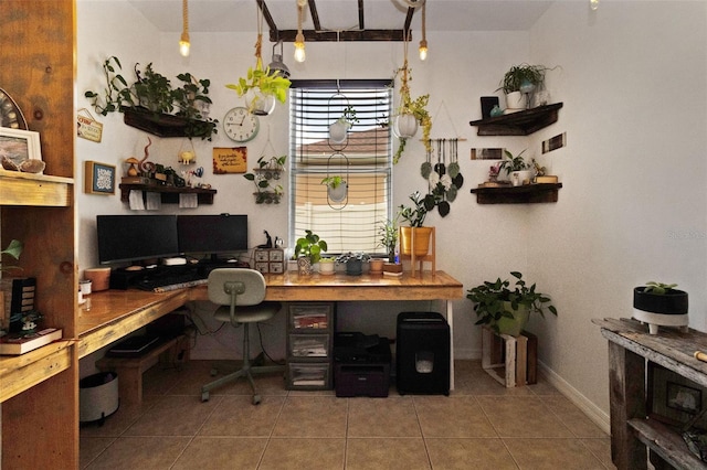 office area featuring tile patterned flooring and built in desk