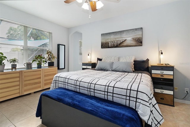 bedroom featuring ceiling fan and light tile patterned flooring