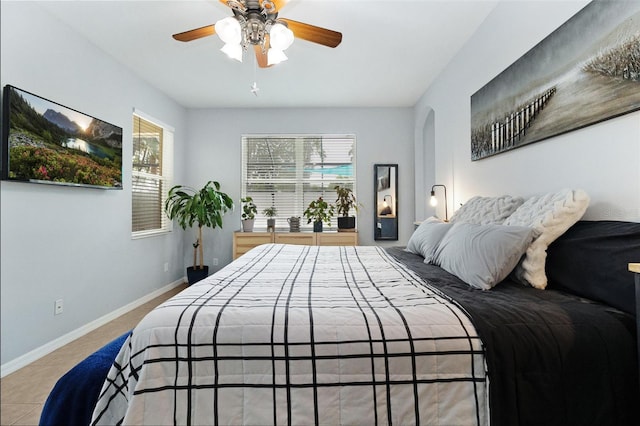 bedroom featuring ceiling fan and light tile patterned floors