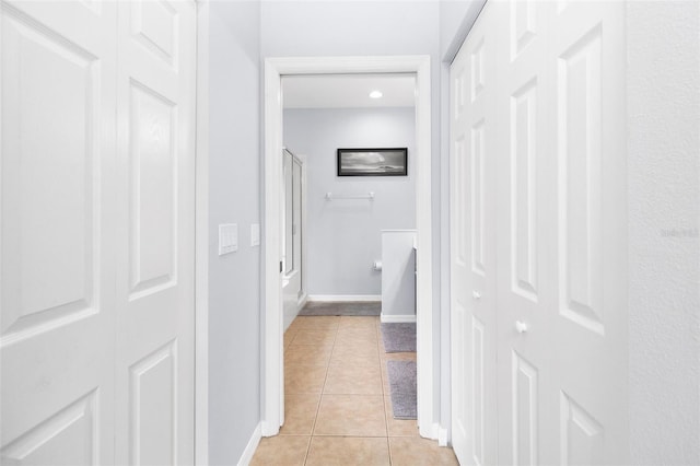 hallway with light tile patterned floors