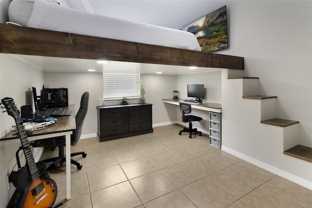 office space with crown molding and light tile patterned flooring