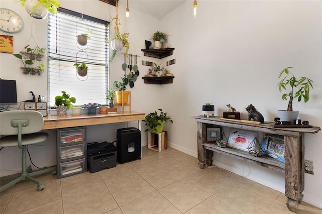 office area with light tile patterned floors