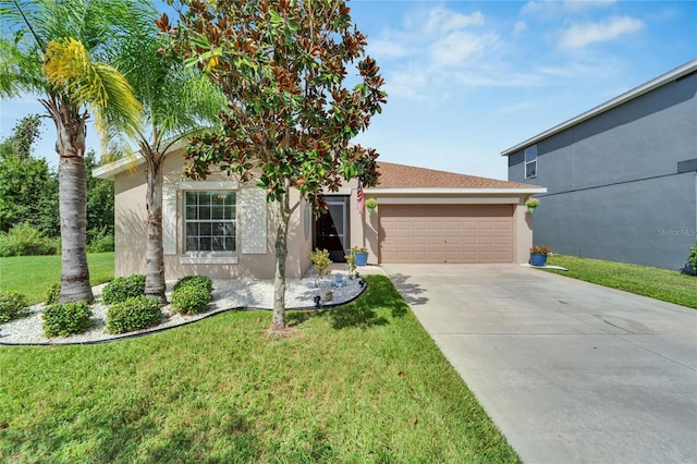 view of front of property with a garage and a front lawn