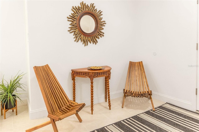 sitting room with light tile patterned floors