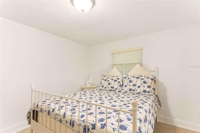 bedroom featuring a textured ceiling