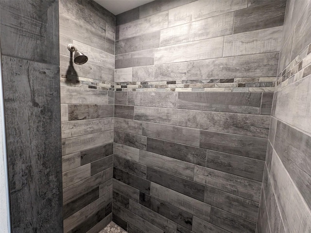 bathroom with tiled shower