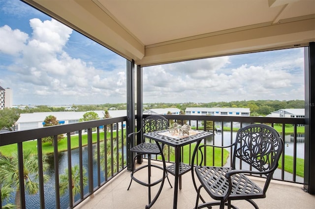 balcony featuring a water view