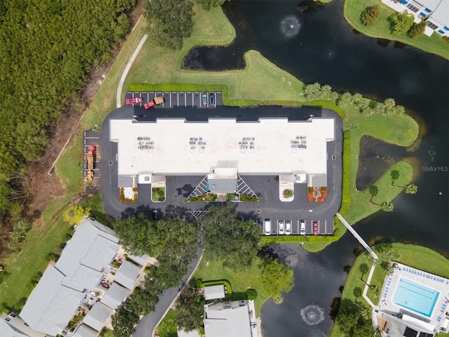 birds eye view of property with a water view