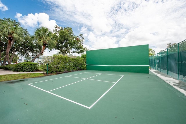 view of tennis court featuring basketball court