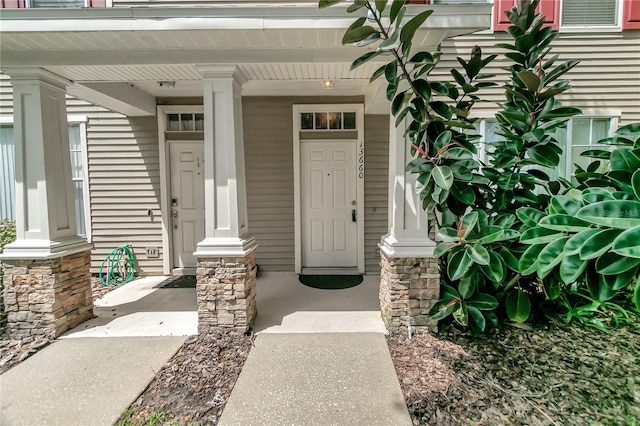 property entrance featuring a porch