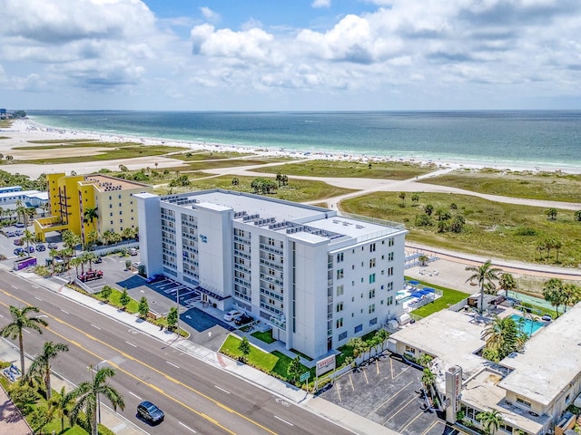 birds eye view of property with a beach view and a water view