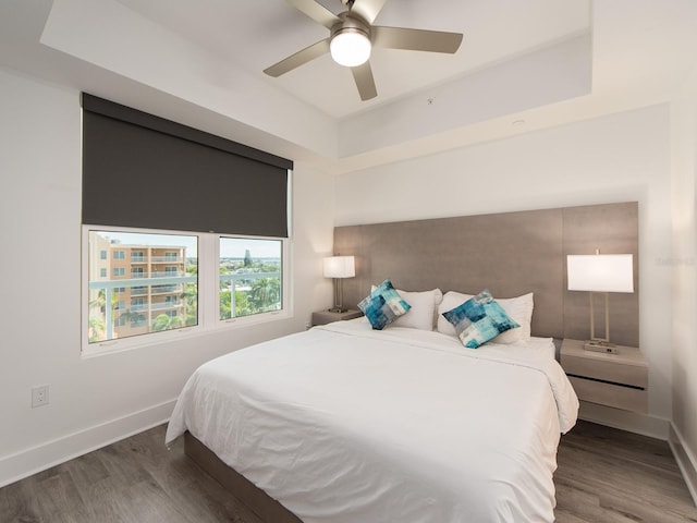 bedroom featuring ceiling fan and dark hardwood / wood-style floors