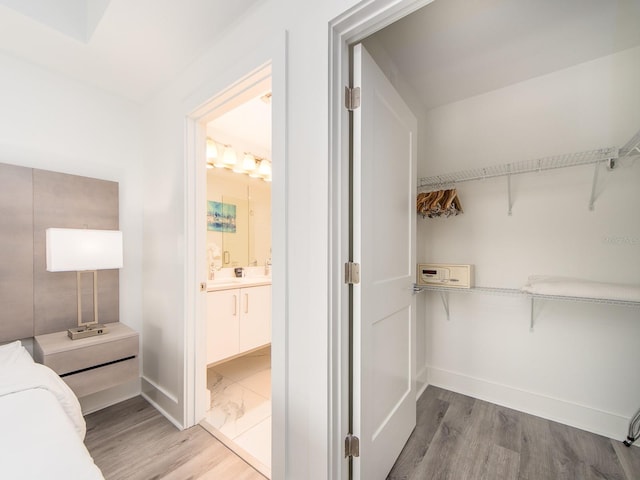 spacious closet featuring hardwood / wood-style floors