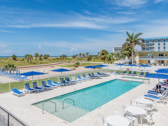 view of pool featuring a patio