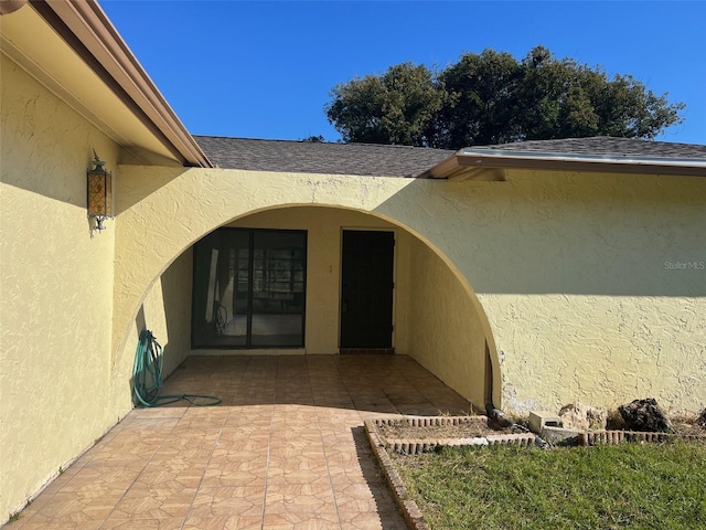 property entrance with a patio area