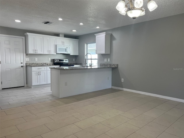 kitchen with white cabinets, kitchen peninsula, stainless steel range with electric cooktop, and a textured ceiling