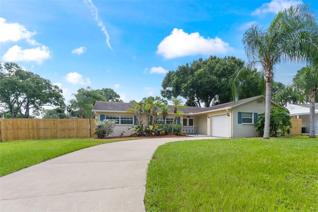 ranch-style house with a front lawn and a garage