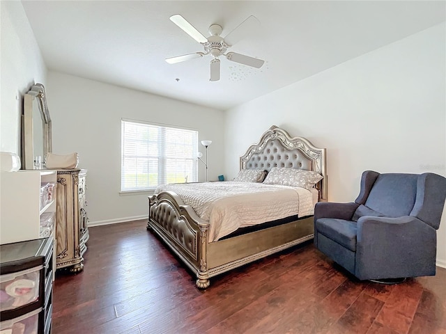 bedroom with ceiling fan and dark hardwood / wood-style floors