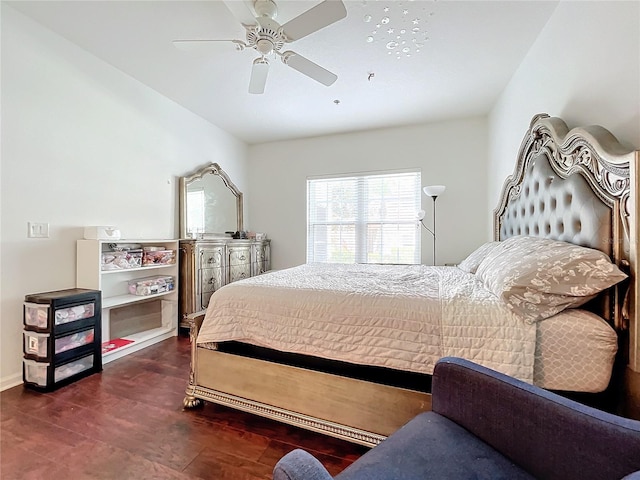 bedroom with dark hardwood / wood-style floors and ceiling fan