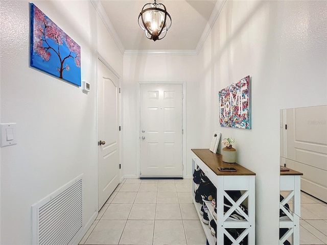 interior space featuring ornamental molding, light tile patterned floors, and a notable chandelier