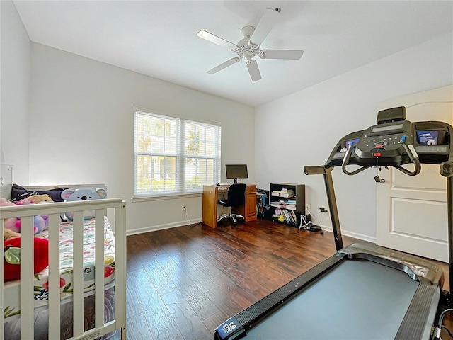 interior space with ceiling fan, a nursery area, and dark hardwood / wood-style flooring