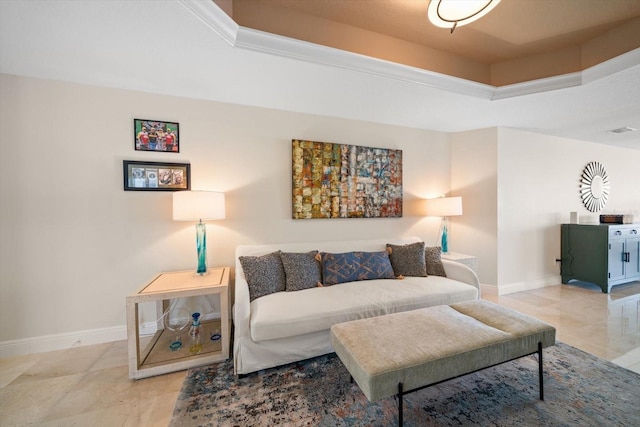 living area featuring a raised ceiling, visible vents, and baseboards