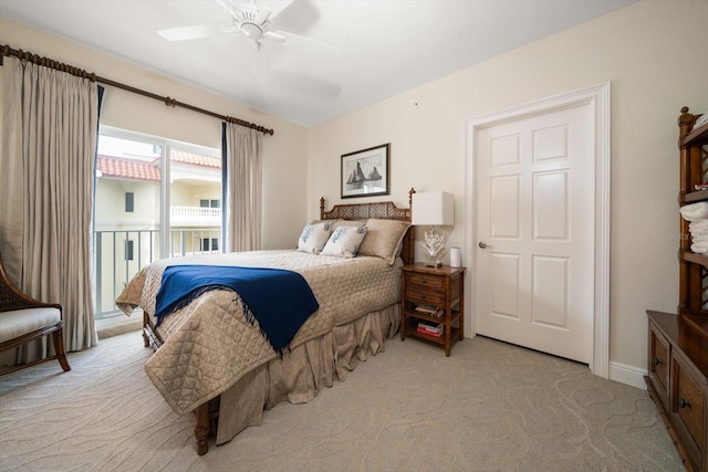 bedroom featuring access to exterior, ceiling fan, and light colored carpet