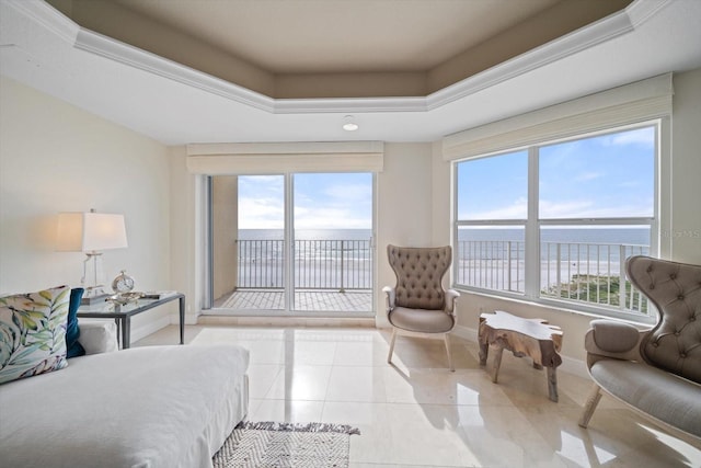 tiled bedroom featuring access to outside, a tray ceiling, a water view, and baseboards