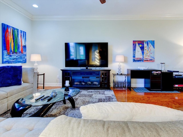 living room with ornamental molding and hardwood / wood-style flooring