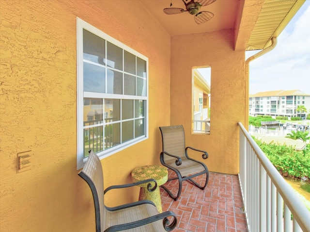 balcony featuring ceiling fan