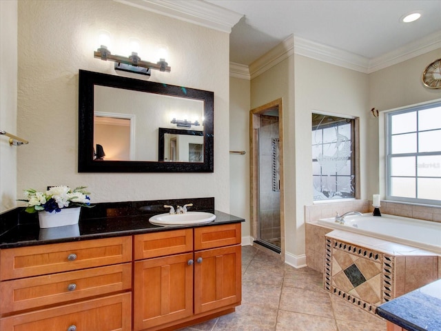 bathroom with tile patterned floors, independent shower and bath, ornamental molding, and vanity