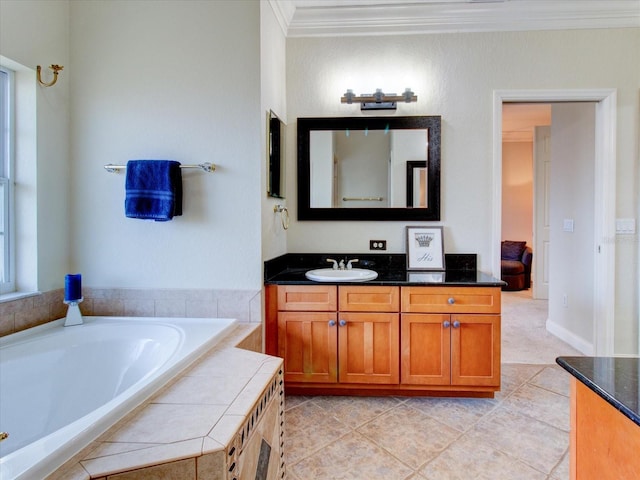 bathroom featuring crown molding, tile patterned floors, a healthy amount of sunlight, a bathtub, and vanity