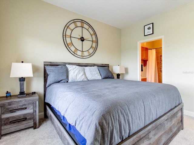 carpeted bedroom with ensuite bathroom