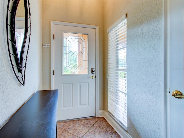 view of tiled foyer entrance