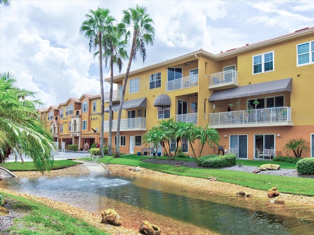 view of building exterior with a water view