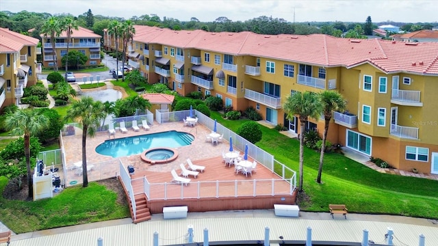 view of swimming pool featuring a lawn