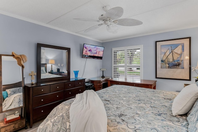 bedroom featuring ceiling fan and ornamental molding