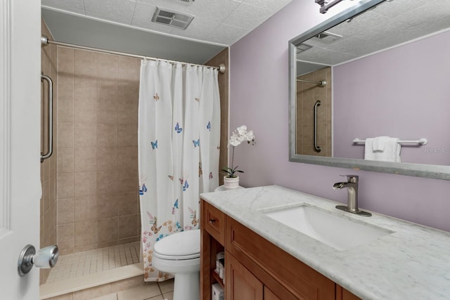 full bath featuring tile patterned floors, visible vents, toilet, a tile shower, and vanity