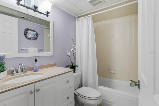 bathroom with visible vents, shower / tub combo, toilet, and vanity