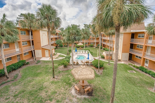 view of home's community featuring a lawn